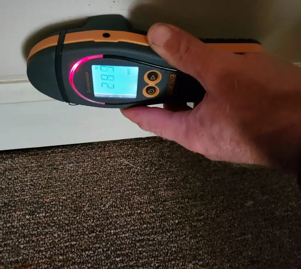 Moisture detection at baseboard during Storm Damage Restoration in Montclair